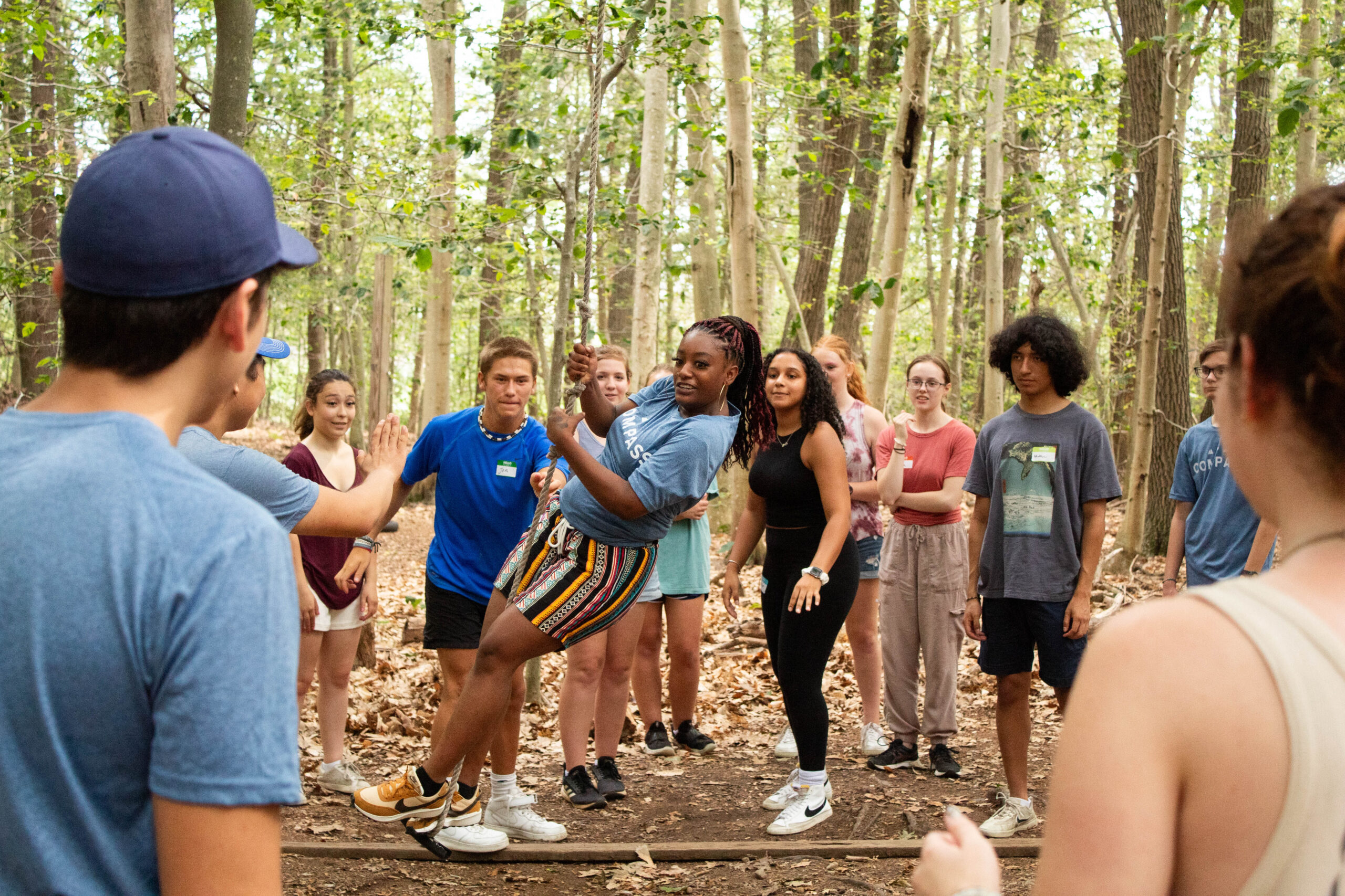 A group participating in the low ropes course.