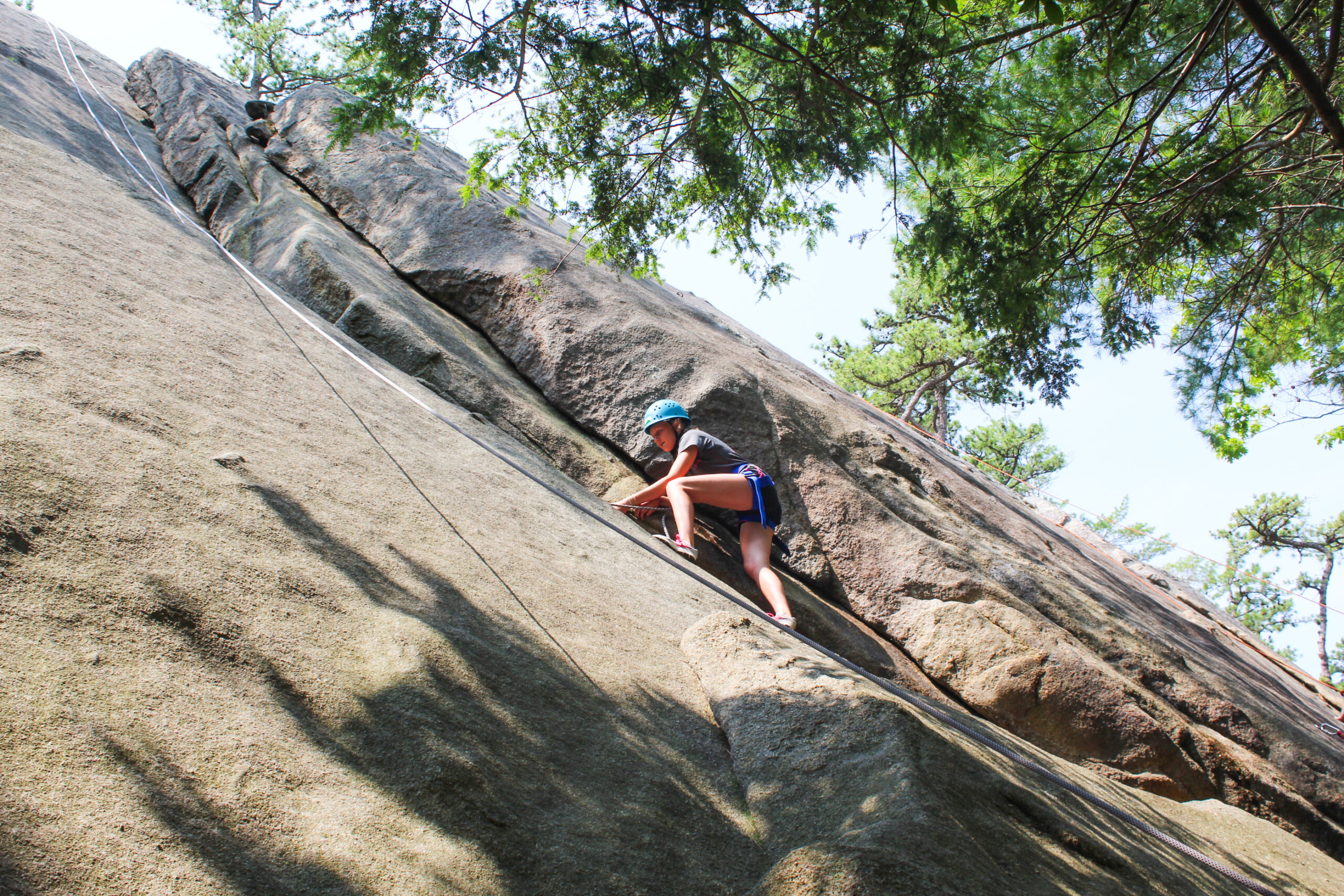 An Adventure Camper rock climbing at Red Rocks. 